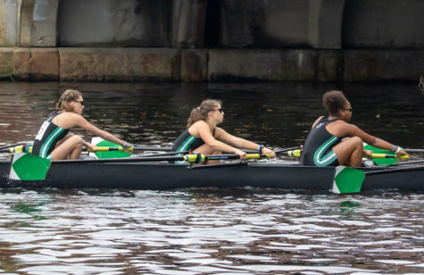 LAST PUSH - Rowers from the Jackson-Reed crew girls second varsity eight in the last 1000 meters of the Head of the Charles Regatta. From left to right: Corinne White, 12, Eden Grim, 10, Kelsie George, 11. 
