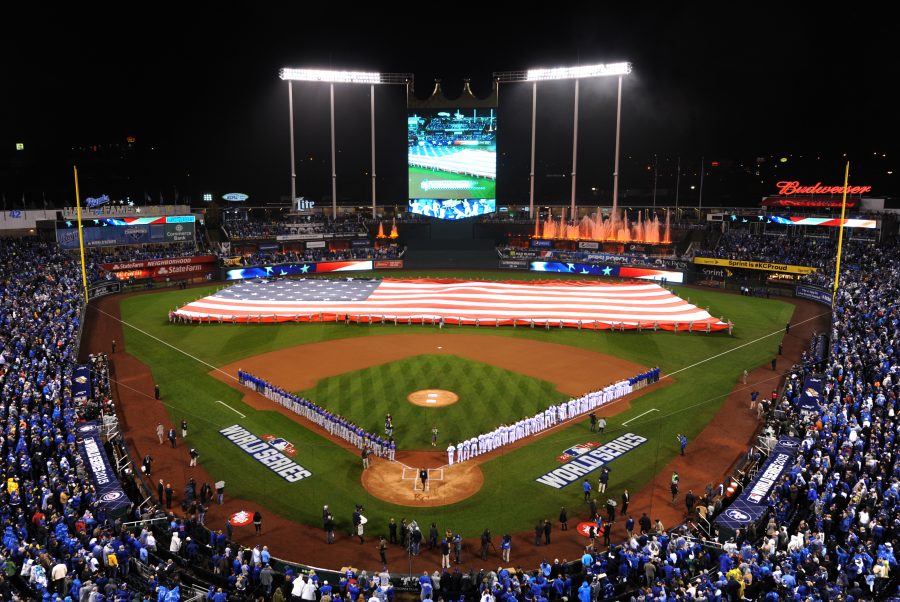Members of Team Whiteman take part in a flag ceremony during pregame ceremonies of the World Series game one at Kauffman Stadium in Kansas City, Mo., Oct. 27, 2015.  More than 100 service members participated in the flag ceremony that took place before the game where the Kansas City Royals defeated the New York Mets 5-4 in 14 innings. (U.S. Air Force photo by Tech. Sgt. Miguel Lara III/Released)
