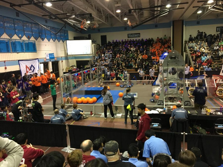 The Stands, shown above, is where each match is held. Two teams of three robots each compete in the center by tossing balls, placing hatches, and climbing pedestals. 