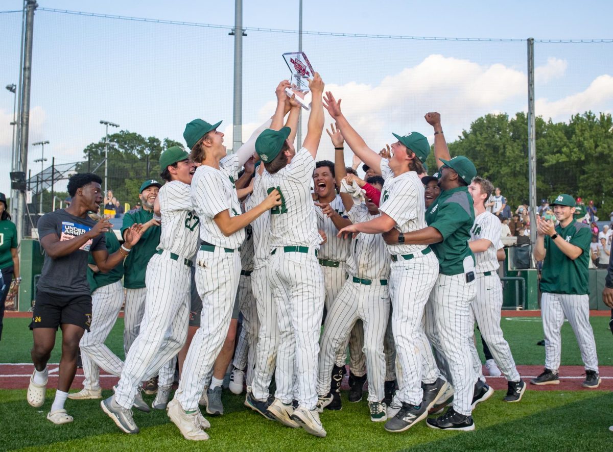 VARSITY BASEBALL CELEBRATES - Baseball team holds up their DCSAA trophy after beating Maret in the finals. This is their first state championship since 2018.